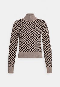 Pull à col roulé beige avec un motif géométrique noir audacieux et des poignets côtelés. Matière douce avec une silhouette ajustée.