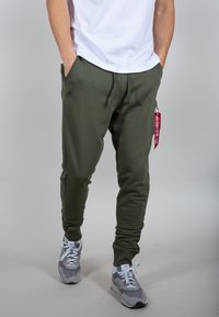 Alpha Industries Donji dijelovi trenirke - dark green