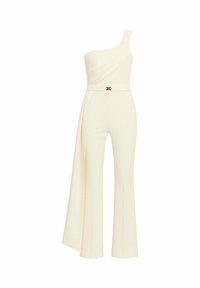 Tuta monospalla color avorio. Presenta una parte superiore drappeggiata, gambe svasate e un dettaglio in metallo dorato in vita. Realizzata in tessuto liscio.