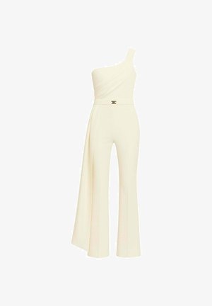 Tuta monospalla color avorio. Presenta una parte superiore drappeggiata, gambe svasate e un dettaglio in metallo dorato in vita. Realizzata in tessuto liscio.