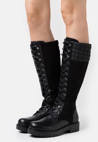 Rieker Botas con plataforma - black