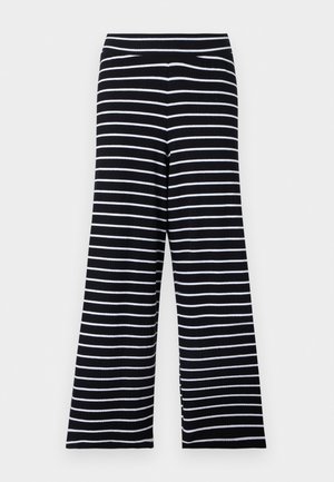 Pantalones negros de pierna ancha con rayas horizontales blancas y cintura elástica, mostrados contra un fondo claro.