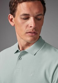 Next Polo - blue ice