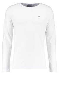 White long-sleeve crew neck shirt with small embroidered logo on the left chest.