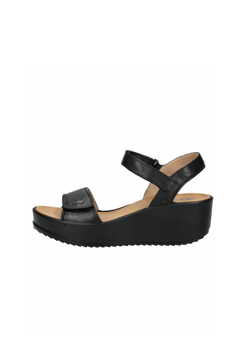 Sandali wedge neri con tomaia in pelle texturizzata, cinturini regolabili e soletta imbottita. Presentano una suola in gomma per una migliore aderenza.