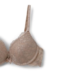 Reggiseno balconette in pizzo color nude, con motivi floreali, spalline in raso regolabili e un piccolo fiocco in raso al centro anteriore.