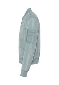 Giacca bomber in nylon azzurro chiaro con zip frontale, polsini a coste e tasca sulla manica sinistra. Texture liscia e design aderente.