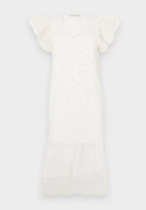 Valge tikanditega kleit V-kaelusega, lühikeste puffvarrukatega ja laieneva hemiga. Omab lillemotive ja lainelisi ääri üle kogu kleidi.