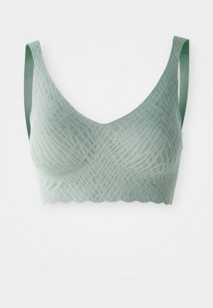  Lichtgroene kant bralette met dunne verstelbare bandjes en golvende randen, met een delicaat geometrisch patroon.