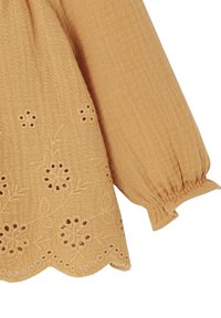 Long beige textured fabric sleeve with elastic cuff and floral embroidery along scalloped hem.