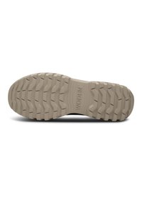 Semelle de chaussure en caoutchouc, de couleur beige clair, avec un motif ondulé et texturé pour une meilleure adhérence. Logo "WODEN" embossé à la surface.