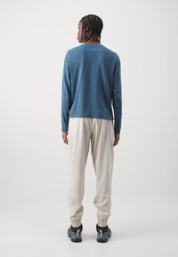 Columbia PFG UNCHARTED™ PULL ON PANT - Pantalones montañeros largos - dark stone