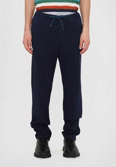 Pantalon taille élastique bleu marine avec un cordon de serrage, ayant une coupe ample et des poches latérales, fabriqué à partir d'un tissu doux et respirant.