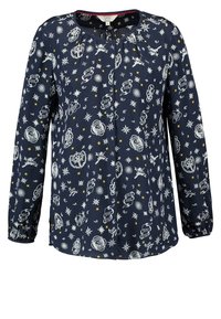 Blouse bleu marine à manches longues ornée de symboles et motifs célestes et tatouages ailés en blanc et jaune sur toute la surface.