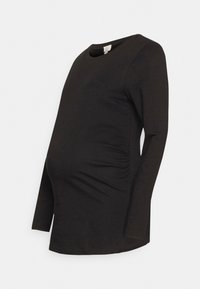 Camisola de maternidade preta de manga longa com decote redondo, apresentando franzidos laterais para um ajuste justo e em material de algodão suave.