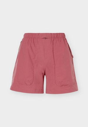 Shorts rose à taille élastique avec coutures frontales, poches latérales zippées et ourlet légèrement arrondi.
