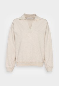 Pull beige avec col en V et col, en tissu doux. Manches longues avec poignets et ourlet côtelés, texture lisse, design minimaliste.