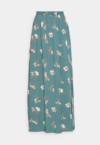 Maxihame royal sinisellä kankaalla, jossa on vaaleanpunaisia, kermanvärisiä ja ruskeita kukkakuoseja. Varustettu joustavalla vyötärönauhalla ja sivuhalkioilla liikkumisen helpottamiseksi.