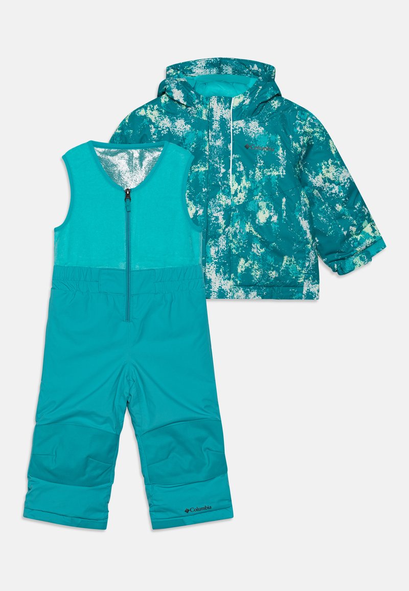 Veste imperméable turquoise avec un motif éclaboussant et salopette assortie turquoise avec zip réglable. Comprend une taille élastique et des genoux renforcés.