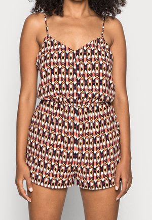 Combinaison colorée avec un motif géométrique en orange, jaune et noir. Confectionnée en tissu léger avec des bretelles fines réglables et une taille élastique.