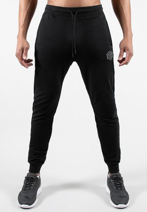 NKMR  - Pantalon de survêtement - black