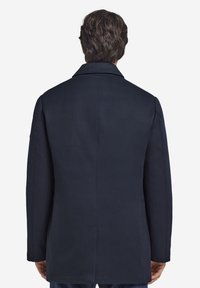 Marineblauer Mantel aus Wollmischung mit Reverskragen, einfacher Gehschlitz und geradem Schnitt. Glatte Textur und minimalistisches Design, geeignet für legere Kleidung.