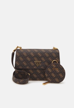 Dark brown Guess crossbody bag and matching round coin pouch with gold logos and hardware on a white background.
