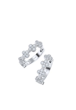 Pair of silver hoop earrings decorated with small clustered round diamonds forming floral shapes, marked 925 inside.