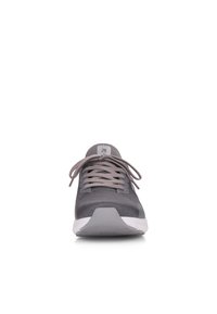 Gray athletic shoe with mesh upper, round toe, and textured sole. Features flat laces and a white rubber accent on the sole.