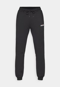 Schwarze Jogginghose aus weichem Stoff, mit einem Kordelzugbund, schmal zulaufenden Beinen und einem kleinen Logo am Oberschenkel.
