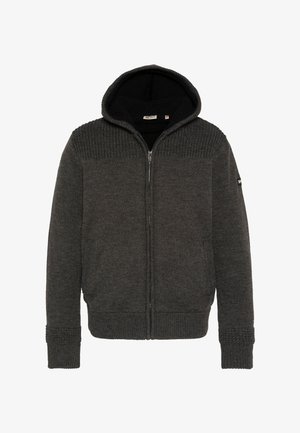 Sudadera con cremallera de color gris oscuro con parte superior de punto texturizado, forro suave de forro polar y puños acanalados. Cuenta con capucha y bolsillos laterales.