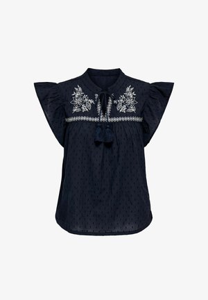 Tummansininen paita, jossa on lyhyet röyhelösleeveet, ja joka esittelee brodeerattuja kukkakuvioita sekä tupsukoristeita kauluksessa. Teksturoitu kangas.