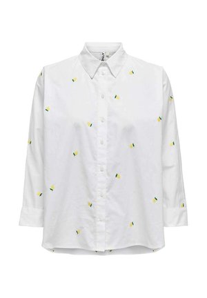 Chemise blanche à boutons avec manches longues, ornée de motifs brodés jaunes et verts ressemblant à des ananas. Texture de tissu lisse.