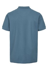 Polokošeľa s krátkym rukávom svetlomodrej farby, vyrobená z hladkej tkaniny. Má klasický golier a rovný lem s čistým prevedením.