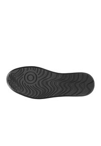 Semelle de chaussure en caoutchouc noir avec un motif de tread ondulé et des détails circulaires, conçue pour l'adhérence et la durabilité. Texture lisse tout au long.