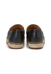 Black leather espadrille shoes with a woven jute sole, featuring a rounded toe and contrasting stitching along the side.