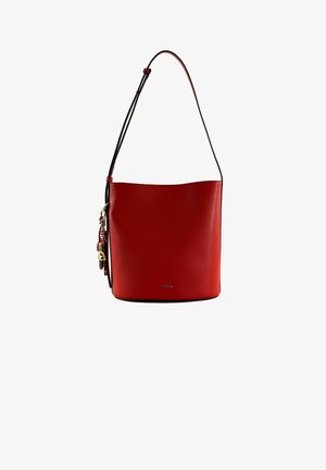 Red leather bucket bag with a smooth texture, a single shoulder strap, and a decorative charm with hardware accents. Logo visible on the front.
