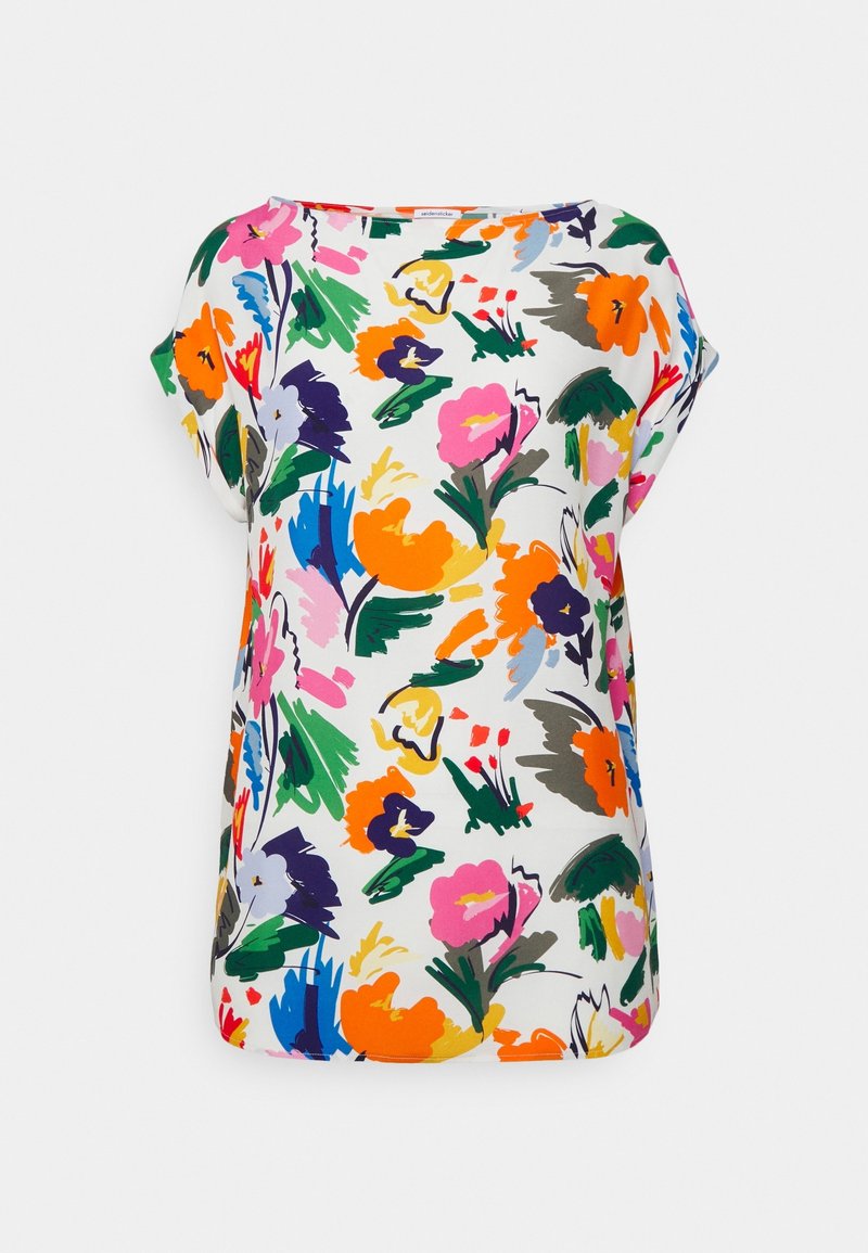 Blouse blanche à manches courtes avec un imprimé floral abstrait coloré en orange, rose, vert, violet et bleu.