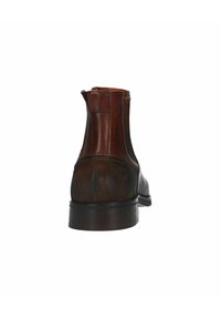 Bottine en cuir marron avec un panneau texturé, un corps lisse, une fermeture à glissière et un petit talon. Présente une finition légèrement usée.