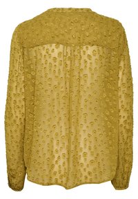 Blouse jaune moutarde transparente à manches longues avec motif floral texturé à pois, vue de dos.