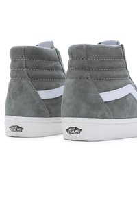 Gray suede high-top sneakers with white accents and stitching. Features a white side stripe and the "Vans Off the Wall" logo on the heel.