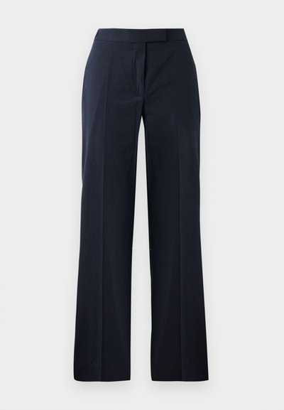 Pantalons navy avec une coupe droite et large, présentant une texture lisse et une taille plate. Pas de poches visibles ni d'embellissements.