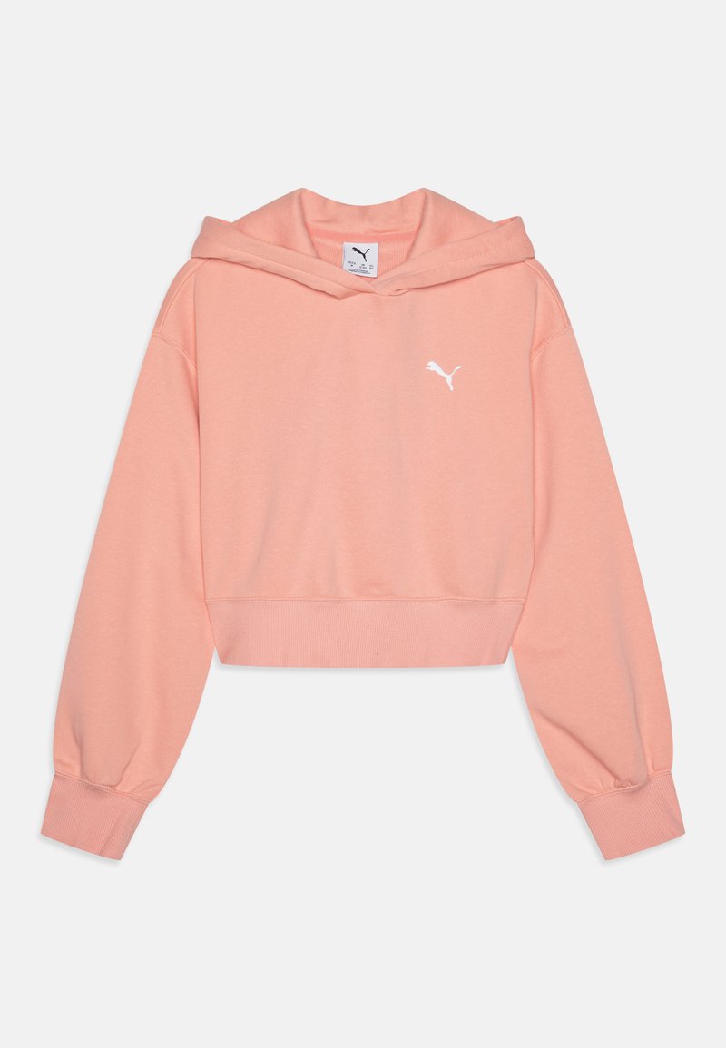 Rettet hettegenser i myk ferskenfarge med lange, ballongfutter og hvit Puma-logo på brystet. Har snor i hetten og ribbestrikket kant.