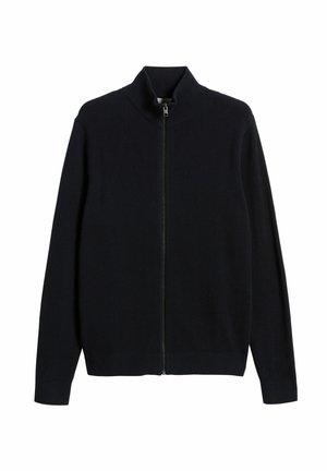 Mörk marinblå zip-up tröja med hög krage, ribbad textur, lång ärm och silverdragkedjedetalj. Enkel, skuren design.
