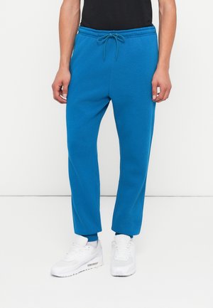 CLUB JOGGER - Pantalon de survêtement - green abyss/white