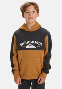 Mikina s kapucí v barevném provedení šedé a hořčicové, s přední kapsou a výrazným logem Quiksilver.