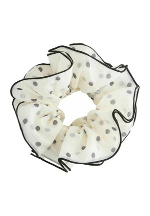 Weißer, durchsichtiger Stoff-Haargummi mit schwarzen Polka-Dots und schwarz umrandetem Volantbesatz.