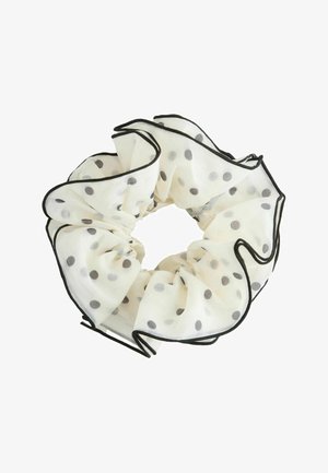 Weißer, durchsichtiger Stoff-Haargummi mit schwarzen Polka-Dots und schwarz umrandetem Volantbesatz.