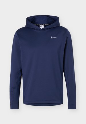 Navyblå Nike hættetrøje med lange ærmer, frontlogo og tætsiddende hætte, enkelt design mod en ensfarvet lys baggrund.