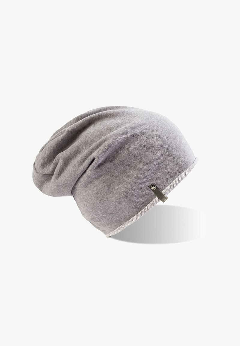 Gray beanie made of soft fabric, featuring a slouchy design with a ribbed white accent along the bottom and a small logo tag on the side.